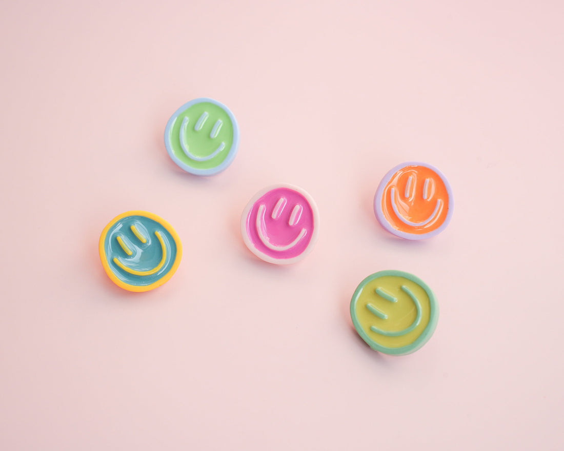 Smiley face pins